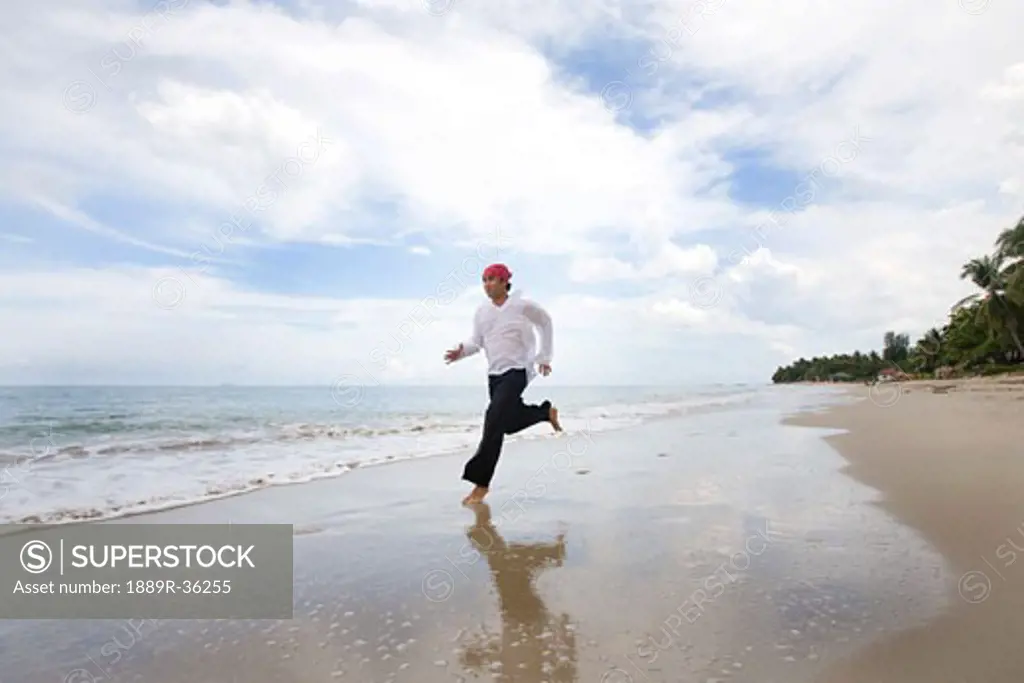 A man running along the beach