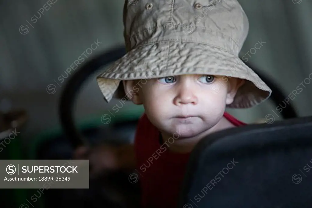A young boy wearing a hat