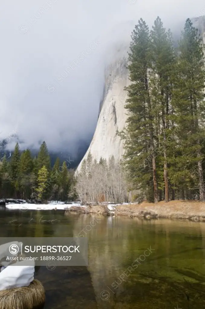 River at foot of mountain, El Capitan, Yosemite National Park, USA