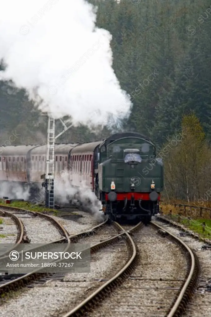 Train on railroad tracks, Grosmont, North Yorkshire, England