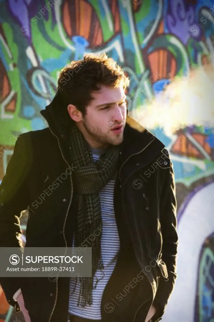 Man wearing coat and scarf