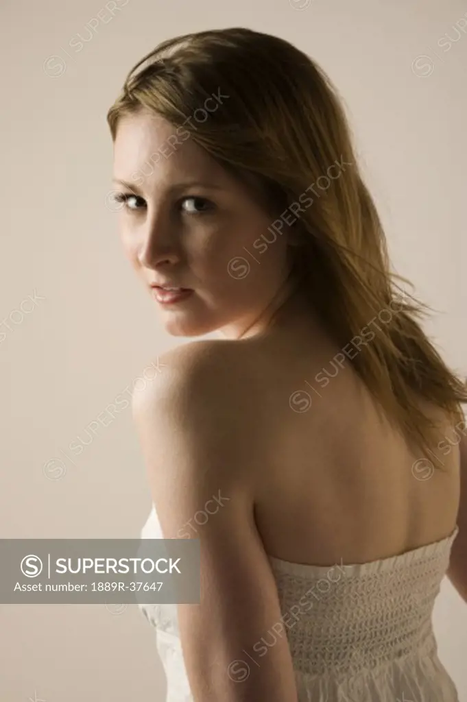 Woman looking over her shoulder