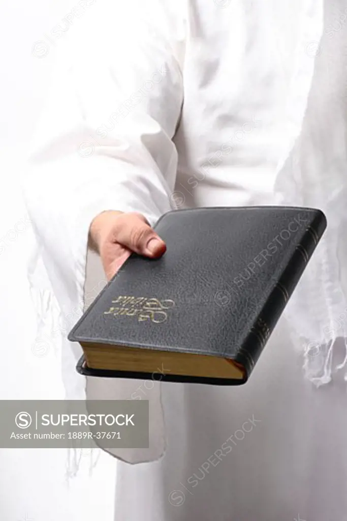 Jesus holding the Bible