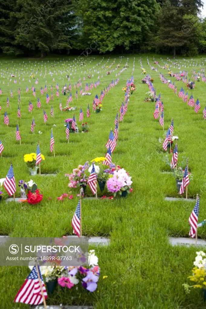 Memorial Flowers And Flags In A Graveyard In Oregon, USA