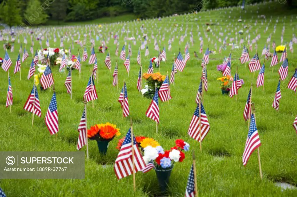 Memorial Flowers And Flags In A Graveyard In Oregon, USA