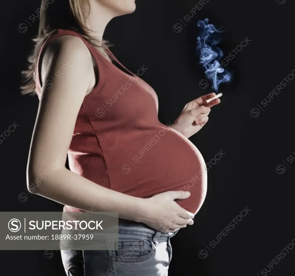 Pregnant Woman Smoking A Cigarette