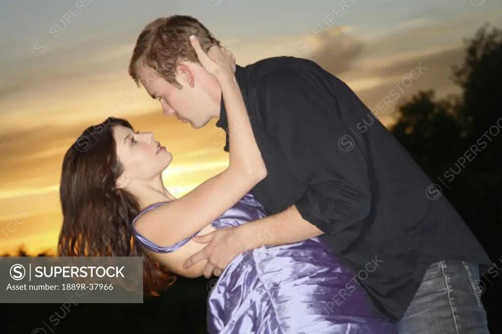 A Young Couple About To Kiss