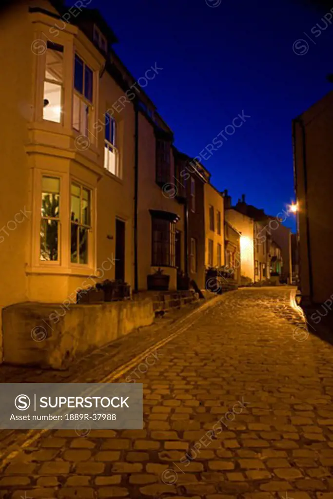 Narrow Cobblestone Road At Night