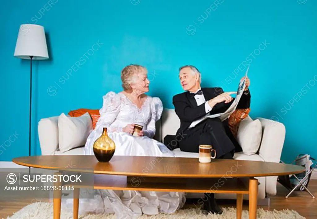 Senior bride and groom in living room 