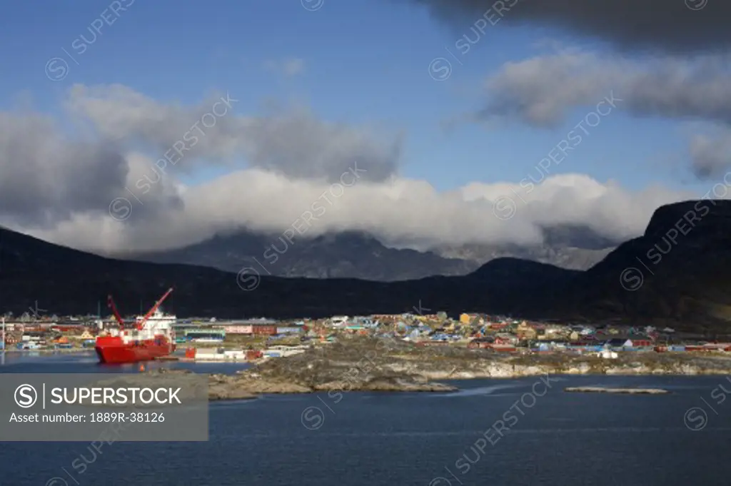 Island Of Qoornoq, Province Of Kitaa, Southern Greenland, Greenland Kingdom Of Denmark, Container Ship Unloading At Nanortalik Port