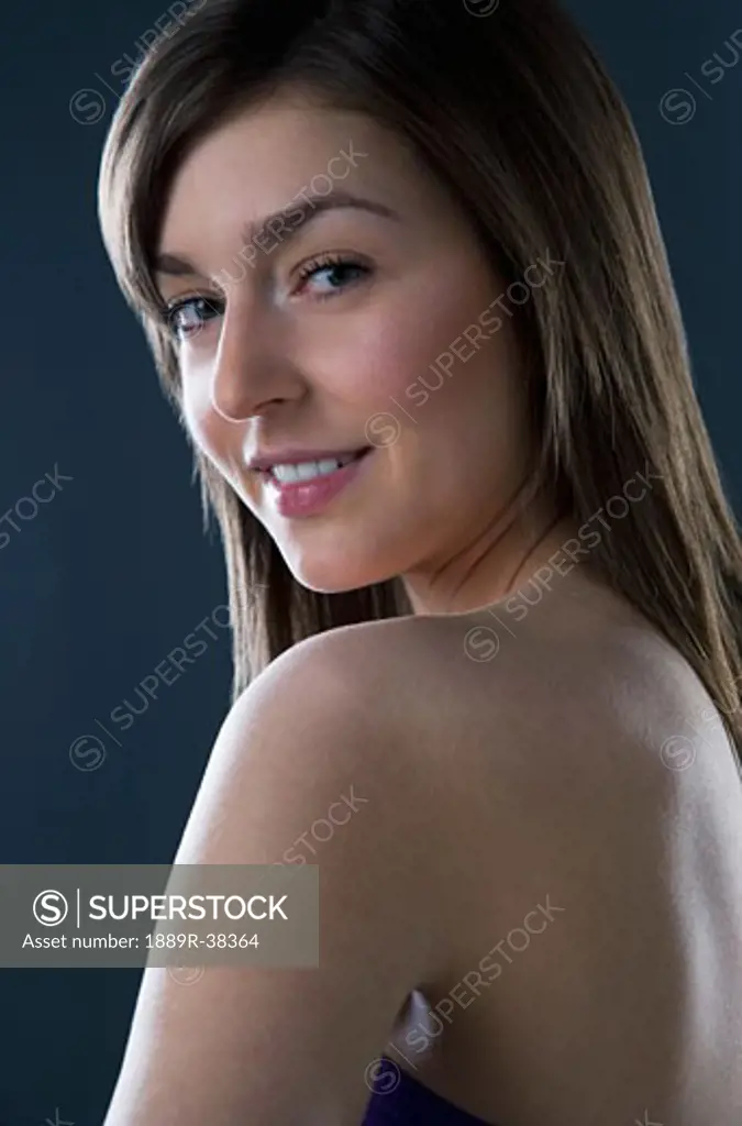 Young woman with a bare shoulder