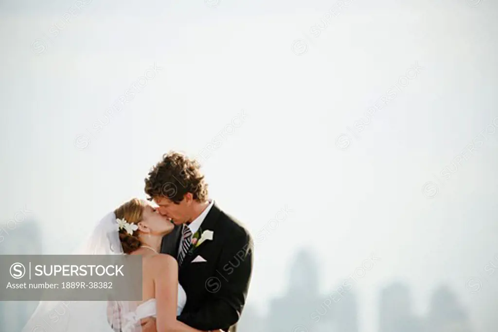 Bride and groom embracing