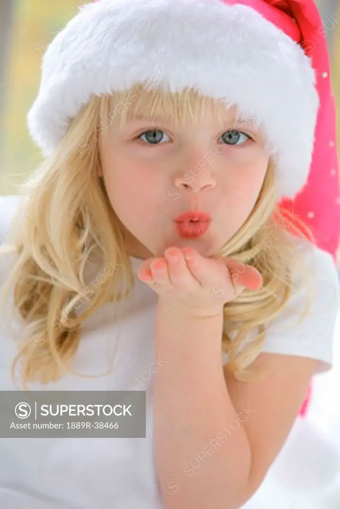 Young girl in Santa's hat