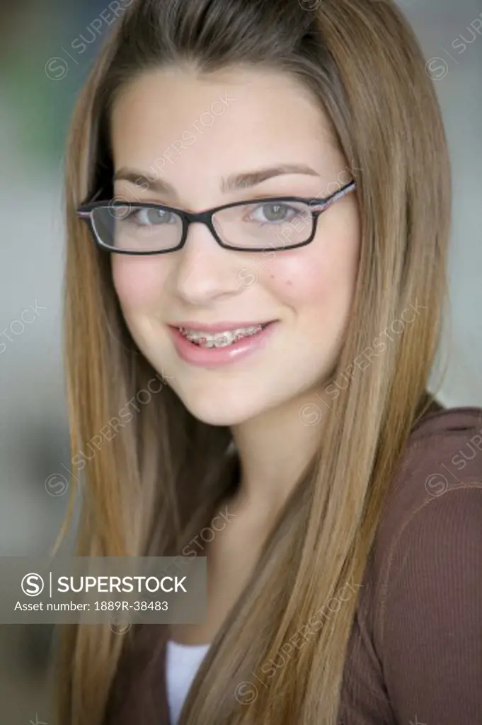 Young girl with glasses and braces