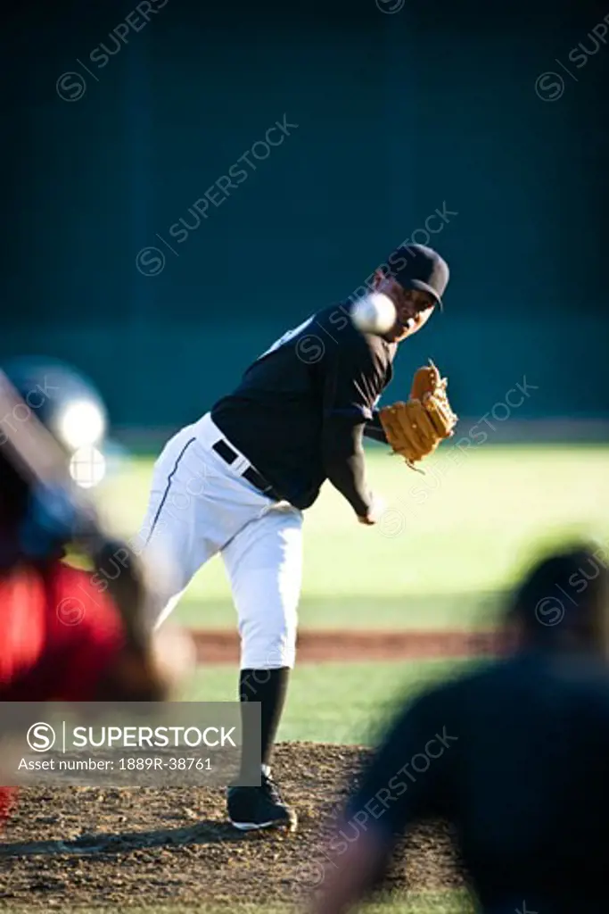 Baseball pitcher throwing
