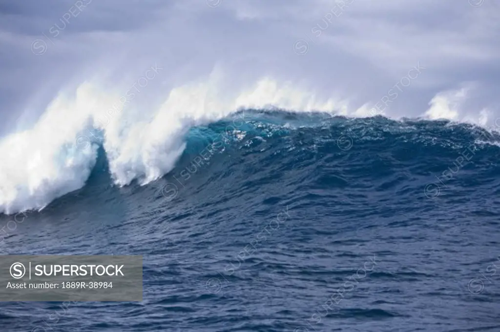 Giant wave breaks near 'Jaws', Maui North Shore, Hawaii, USA  