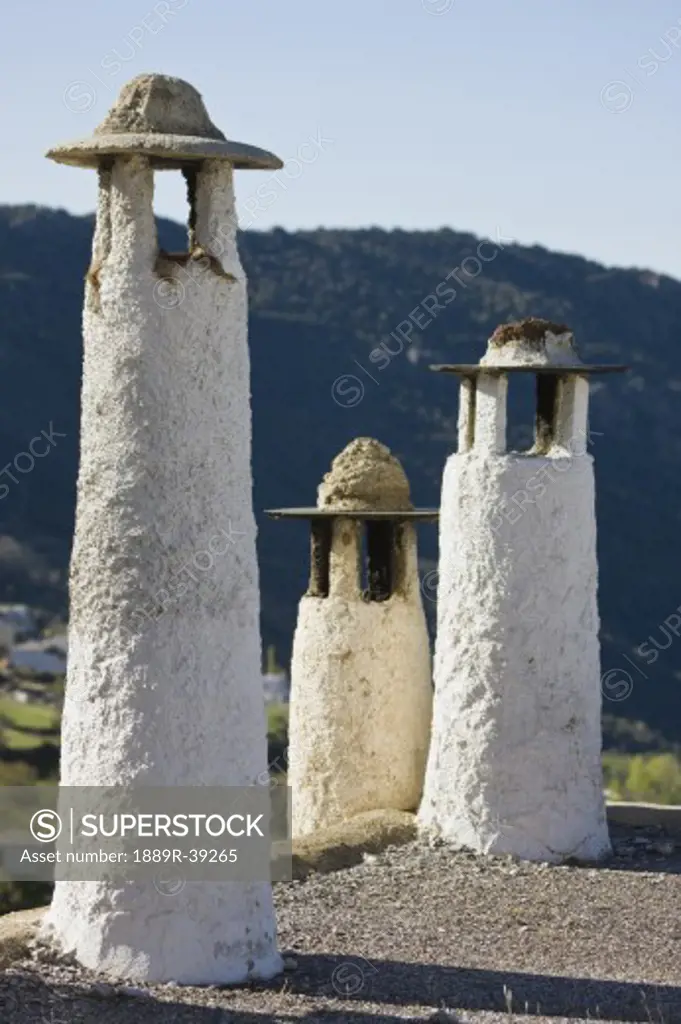Typical chimneys on flat roofs, Capileira, La Alpujarra, Granada Province, Spain,