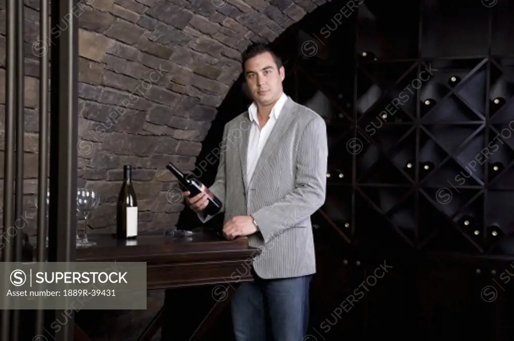 Man in wine cellar