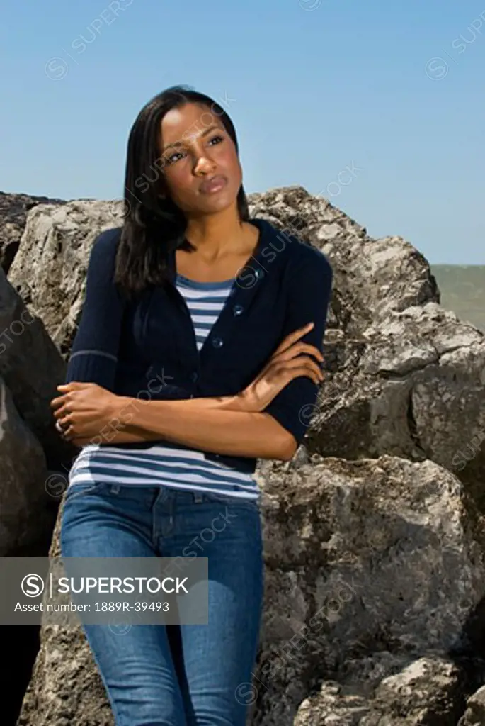 Woman leaning on rocks  