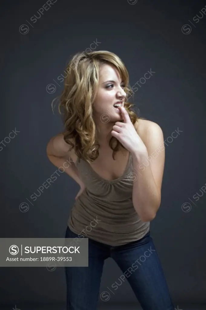 Woman biting her finger