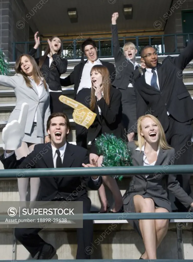 Business people cheering in the stands