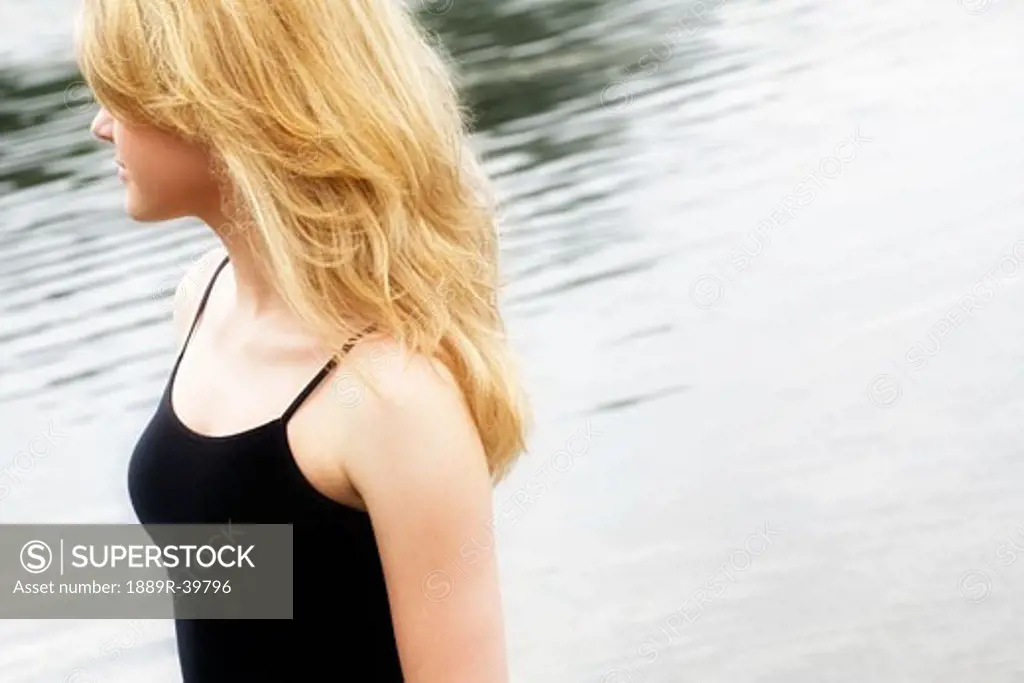 Blond woman by water