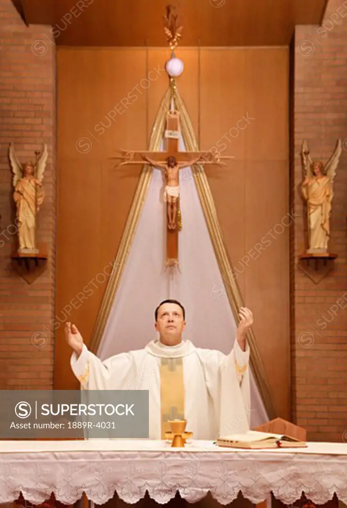 Priest having communion
