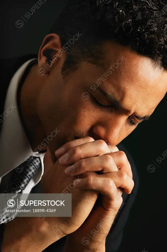Businessman praying