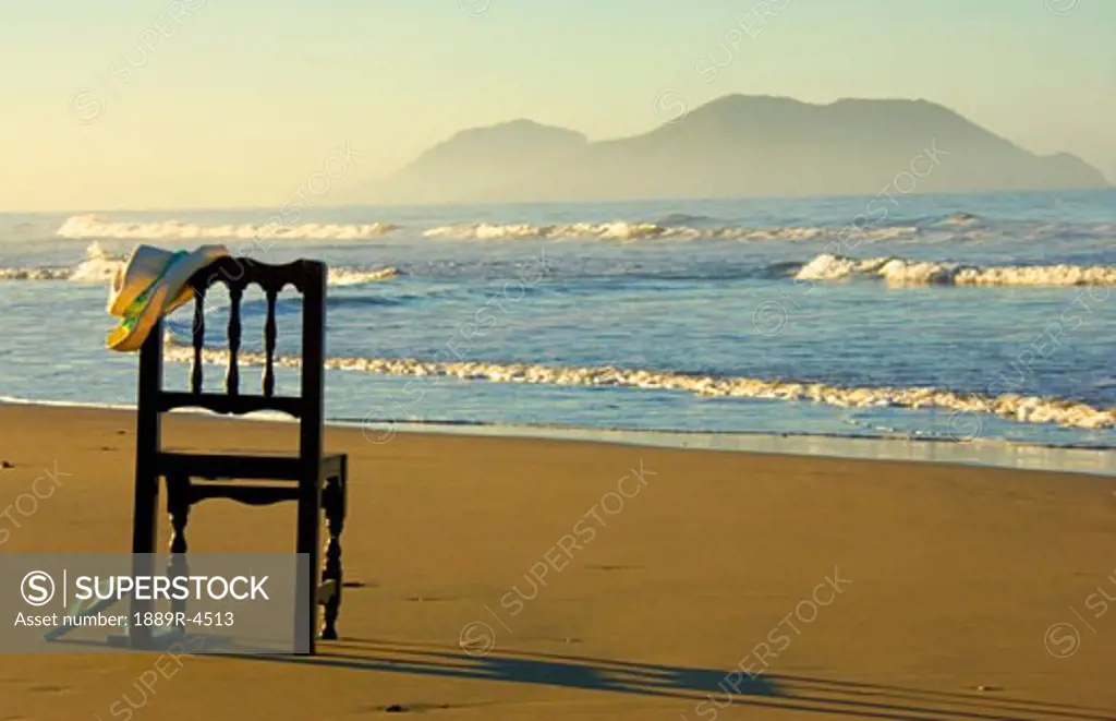 Empty wood chair on a beach