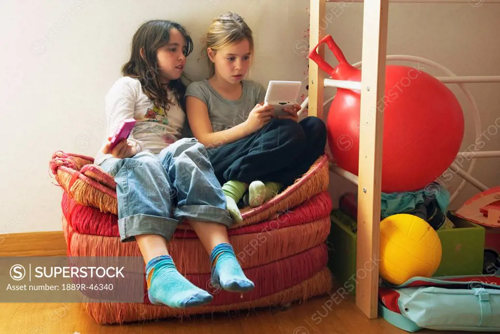 Two girls playing computer game
