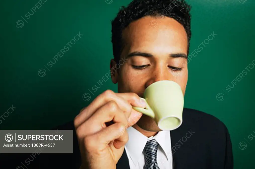 Man drinking from a cup