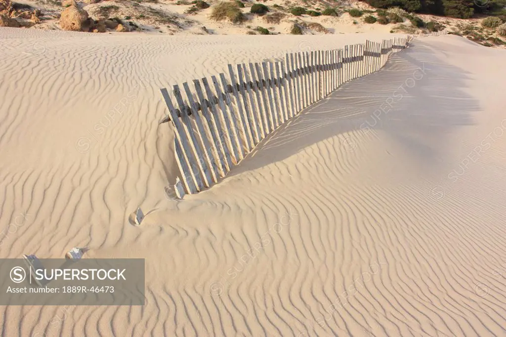 Fence in the sand, Bolongna, Andalucia, Spain