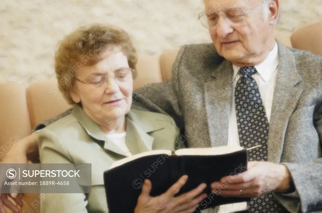 Senior couple reading bible