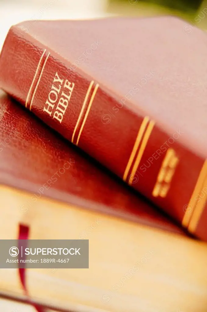 Close up of books including the Bible