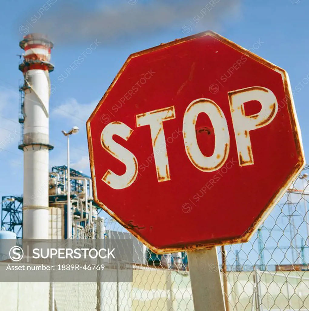 Stop sign near industrial buildings, Cadiz Province, Spain