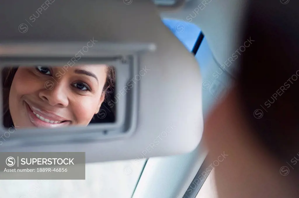 Woman looking into a mirror