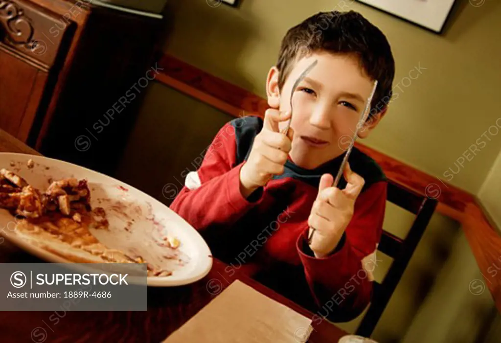 Small boy at the dinner table