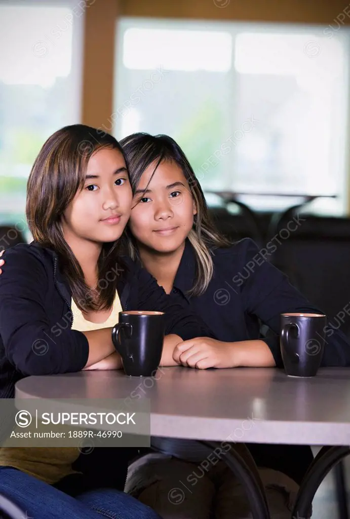 Two girls sitting together