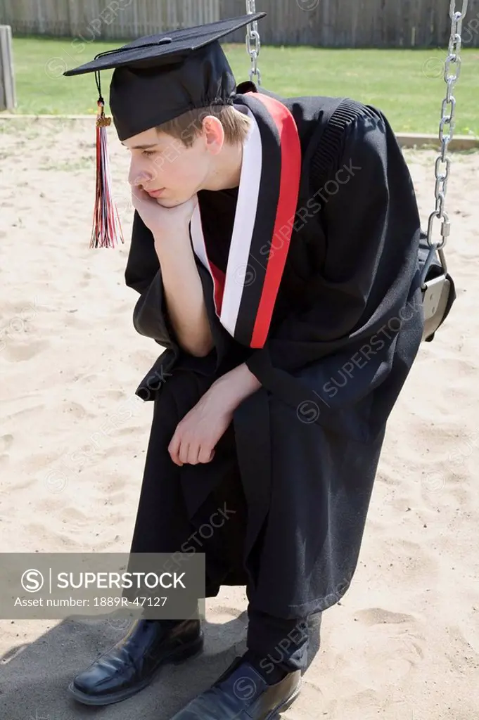 Graduate on a swing