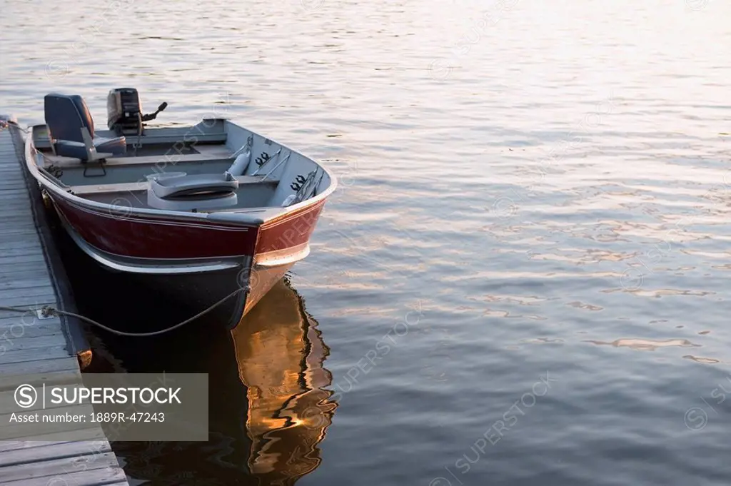 Boat at dock, Lake of the Woods, Ontario, Canada