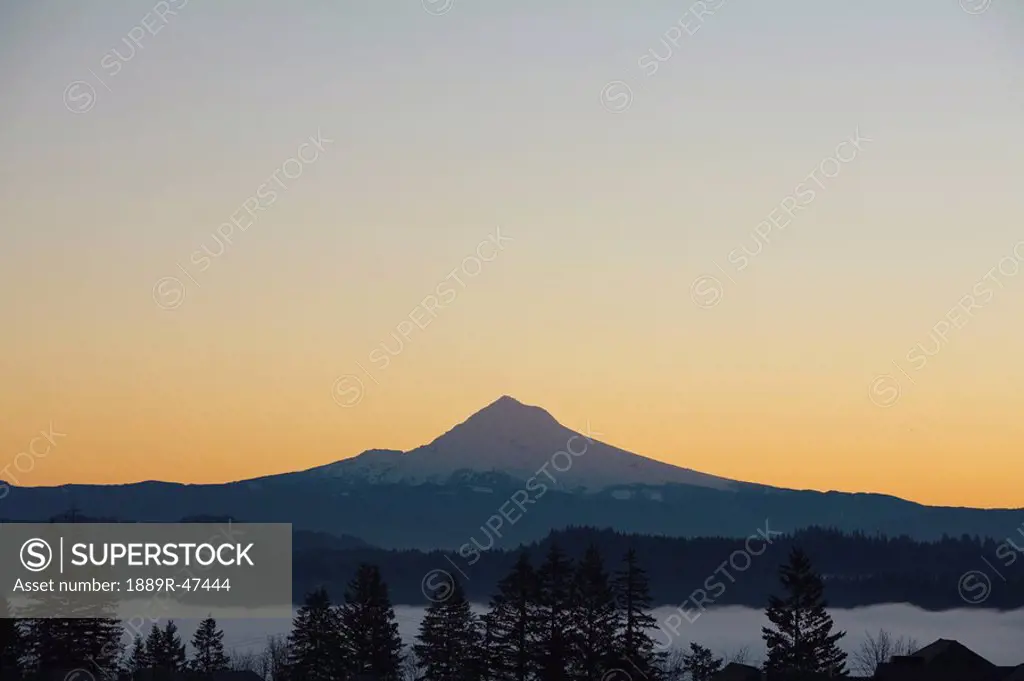 Silhouette of mountain peak at sunrise