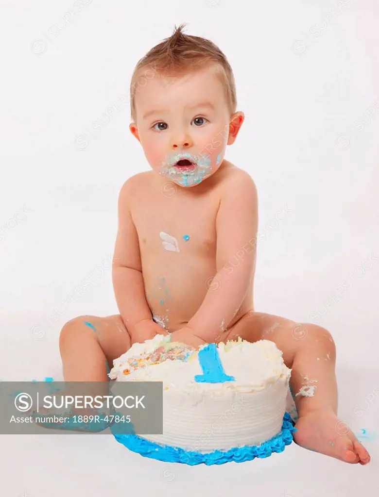 Little boy eating cake