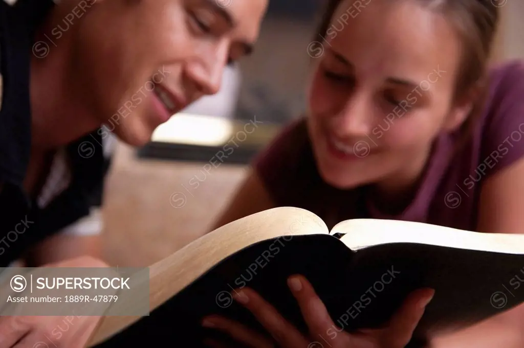A couple reading the Bible together