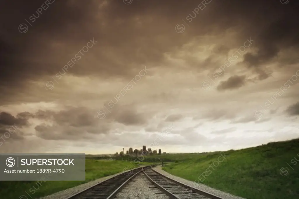 Rail tracks and a distant city