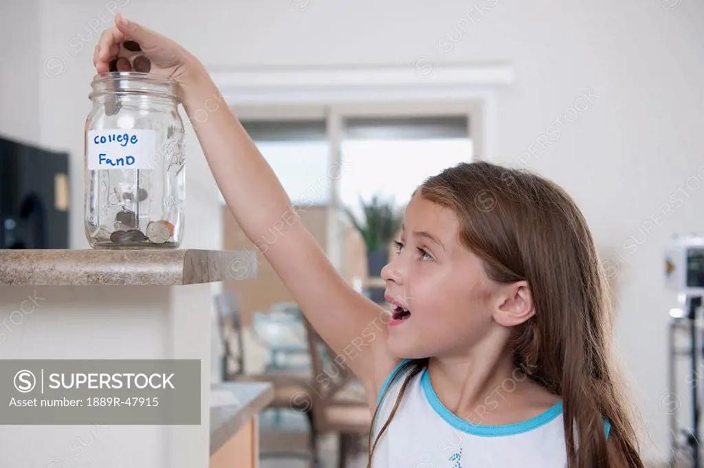 Girl saving for her college fund