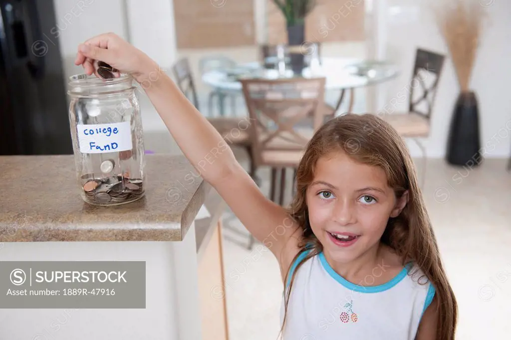 A young girl saving up for her college fund