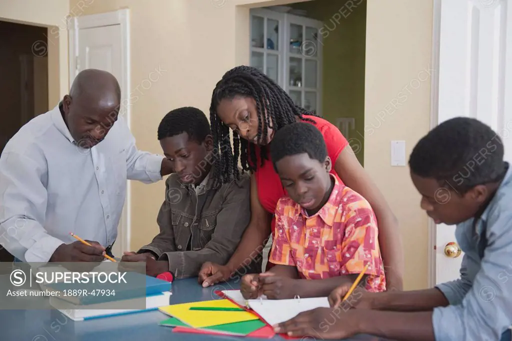Parents helping their children with homework