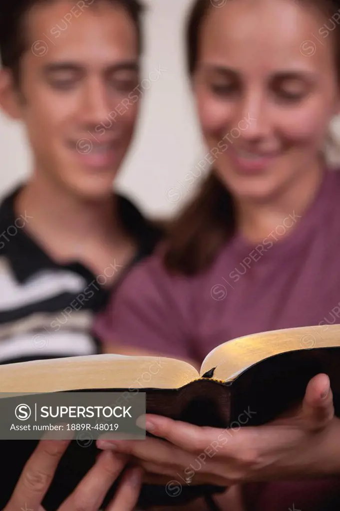 A couple reading the Bible together