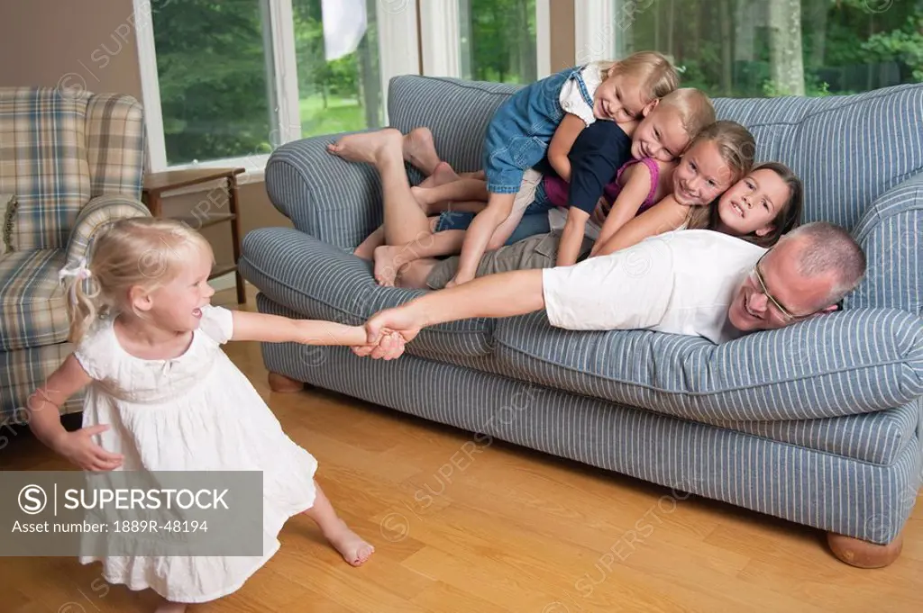 Father playing with his children