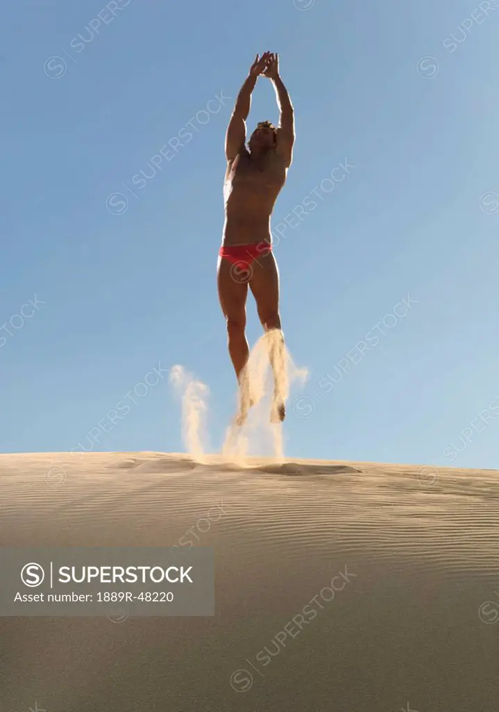 Man working out on a beach